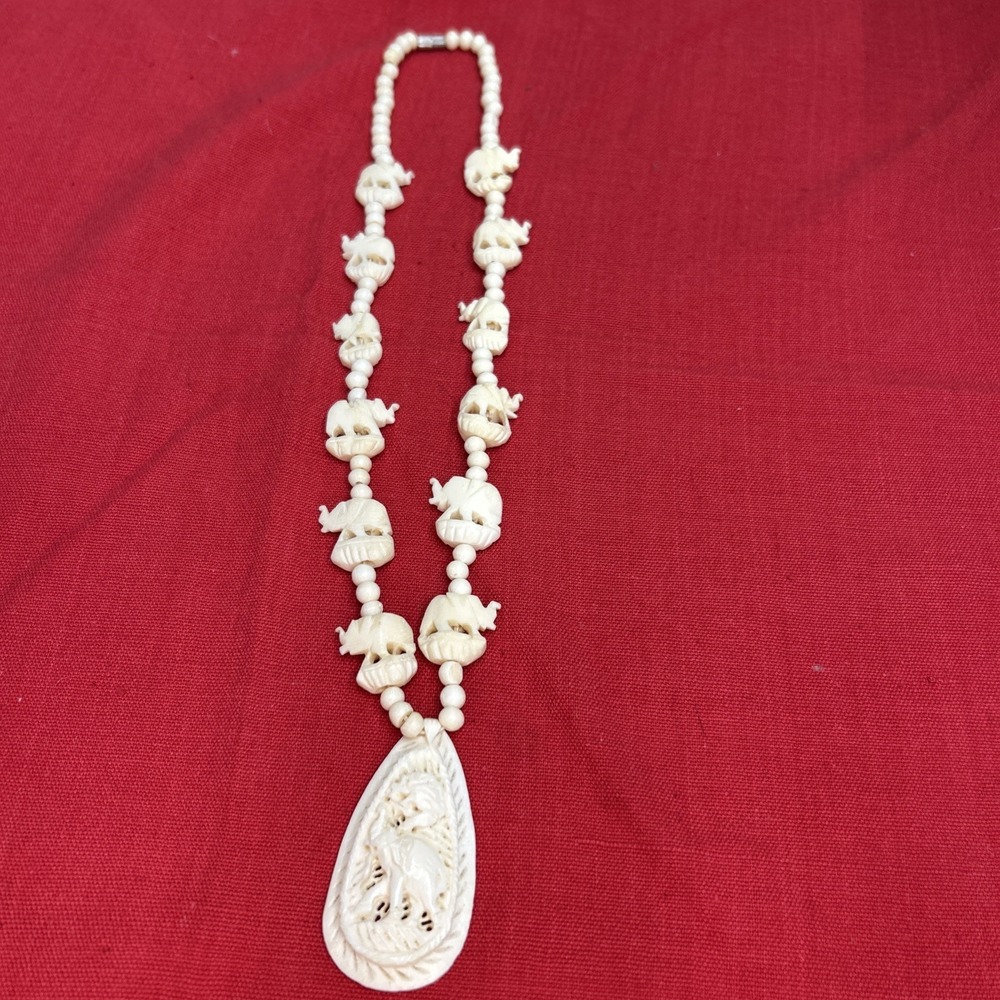 Hand-Carved Elephant Bead Necklace With Ornate Pendant.